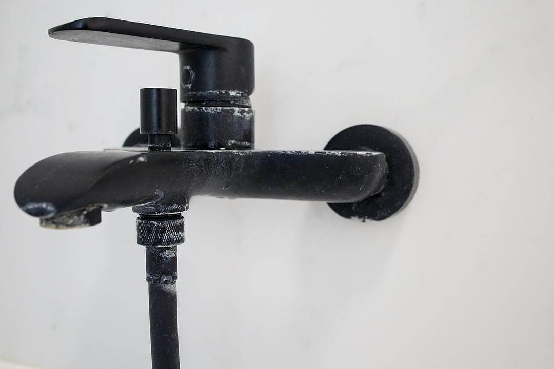 Hard water residue on faucet